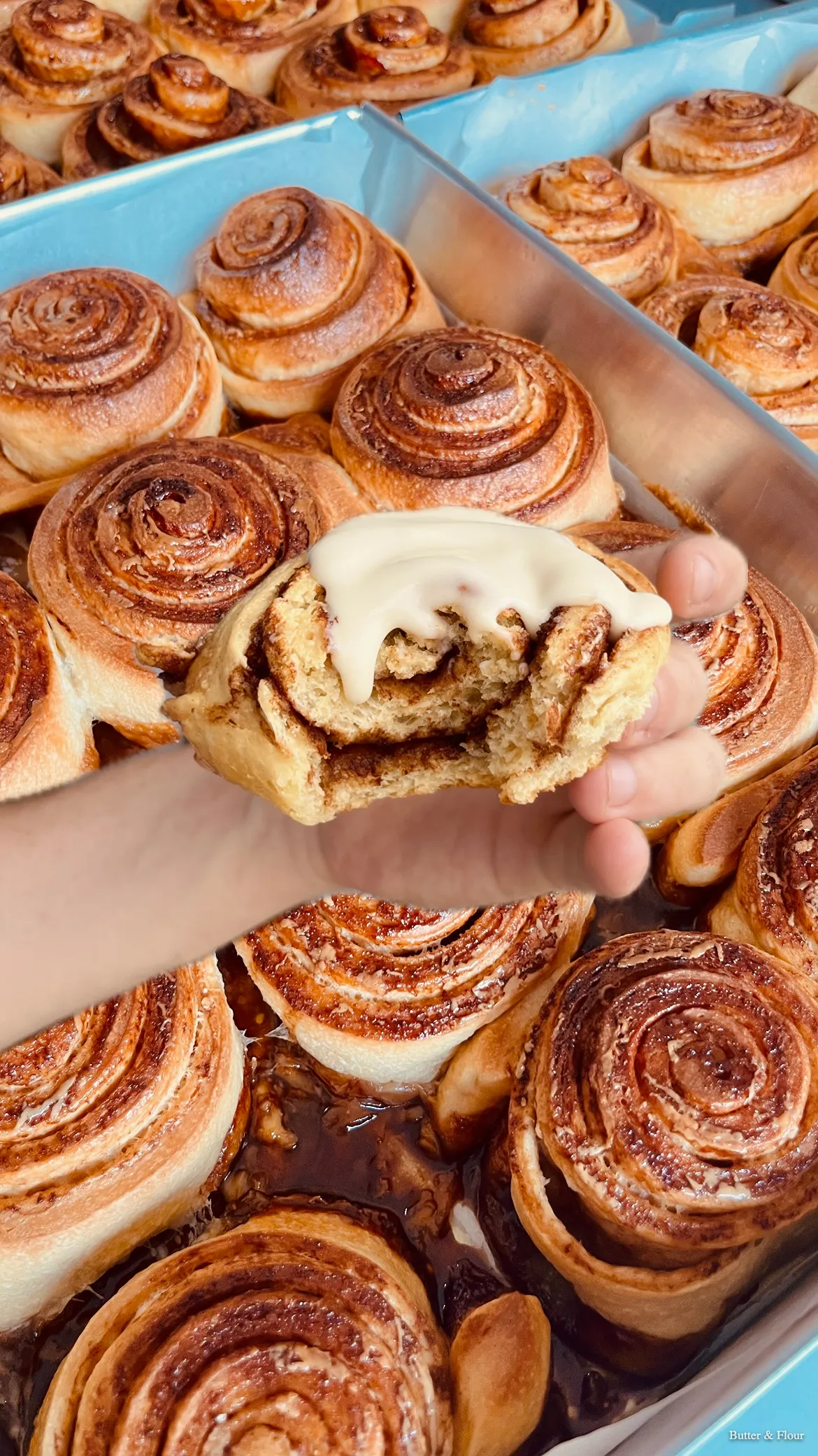 Classic cinnamon roll pulled apart showing filling — Butter and Flour HCMC